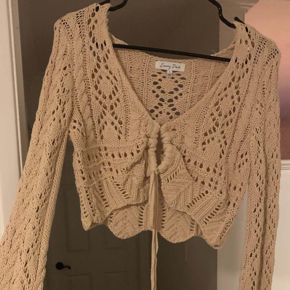 This top has never been worn. The second picture shows the flared sleeves!